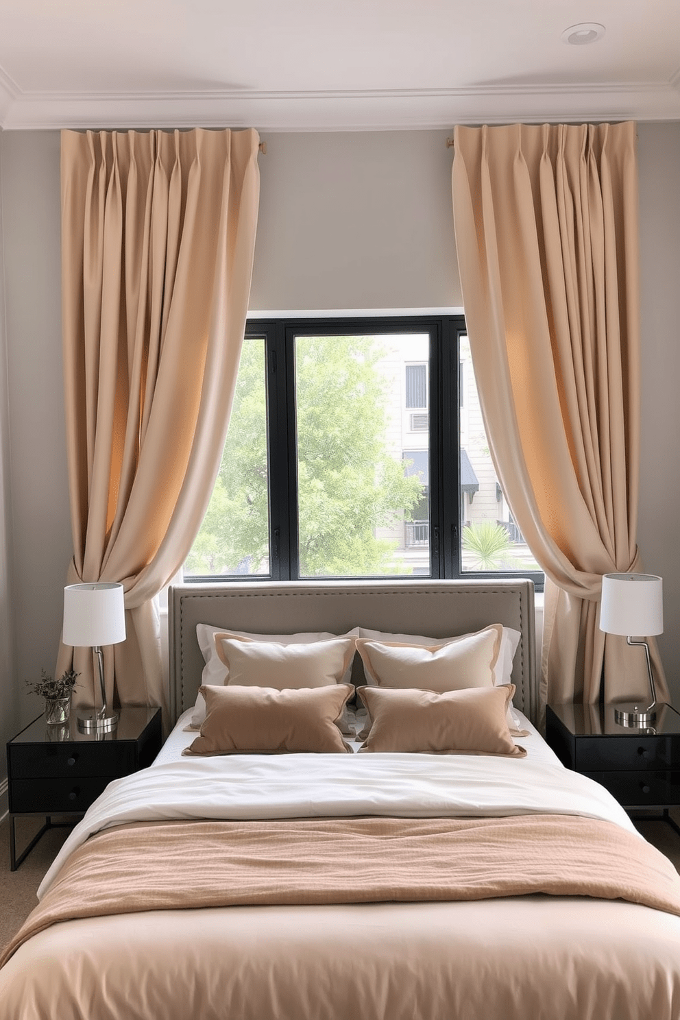 A cozy bedroom in a one-bedroom apartment featuring soft, flowing curtains that frame a large window, allowing natural light to filter in. The curtains are in a warm beige tone, complementing the light gray walls and creating a welcoming atmosphere. The bed is adorned with plush bedding in shades of cream and taupe, with an upholstered headboard that adds a touch of elegance. A stylish nightstand on either side of the bed holds modern lamps, while a small potted plant adds a pop of greenery.