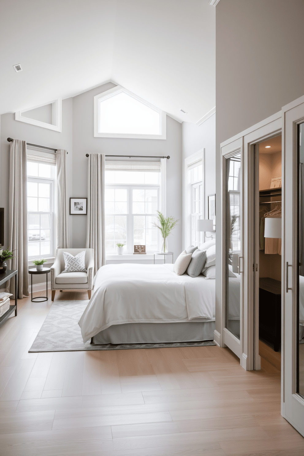 Bright and airy master suite retreat featuring large windows that allow natural light to flood the space. The room is adorned with a plush king-sized bed dressed in soft white linens and accent pillows in pastel shades. The walls are painted in a soft gray hue, creating a calming atmosphere. A cozy reading nook with a comfortable armchair and a small bookshelf is situated near the window, inviting relaxation. Light hardwood flooring complements the overall design, adding warmth to the space. Elegant pendant lighting hangs above the bedside tables, enhancing the sophisticated ambiance. A spacious walk-in closet is seamlessly integrated into the design, providing ample storage. Decorative touches include framed artwork and indoor plants that bring life to the retreat.