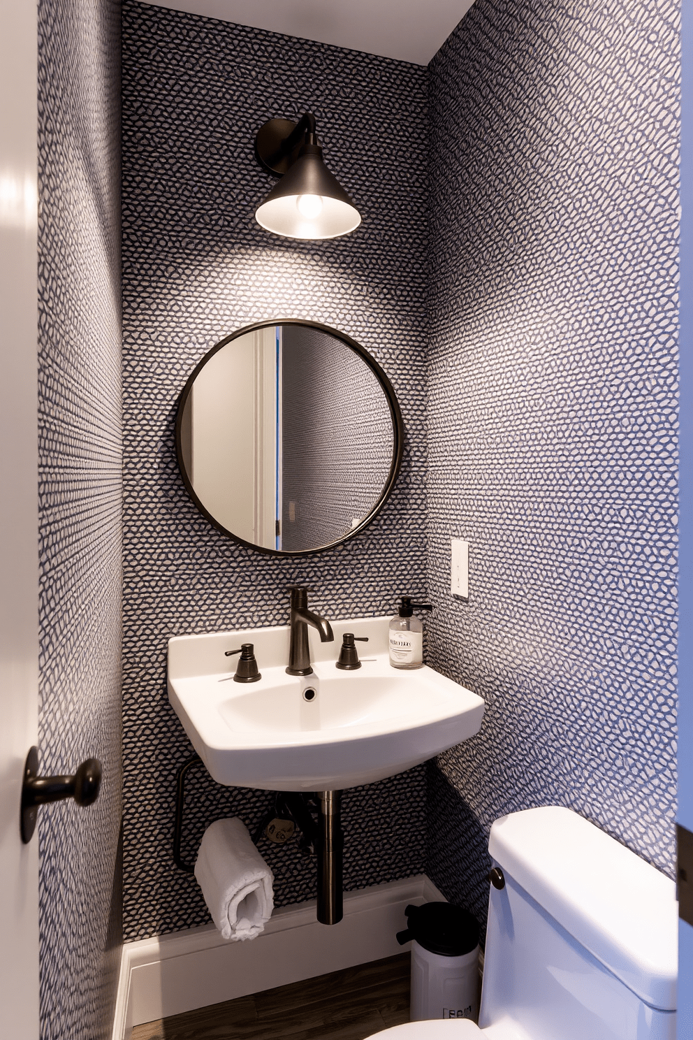 Textured wallpaper adds a unique touch to a 5x5 bathroom design. The walls are adorned with a subtle geometric pattern that complements the sleek fixtures and lighting. A compact vanity with a round mirror creates an inviting focal point. Soft, ambient lighting enhances the overall warmth and elegance of the space.