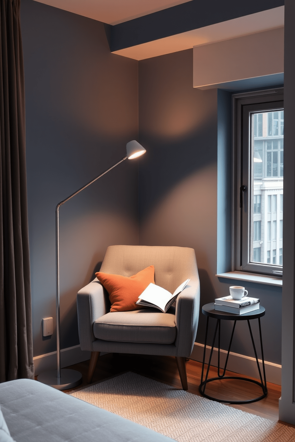 A cozy reading nook is nestled in the corner of a modern apartment. It features a plush armchair upholstered in soft gray fabric and a sleek floor lamp providing warm light. A small side table holds a stack of books and a steaming cup of coffee. The walls are painted in a calming blue hue, and a large window allows natural light to flood the space.