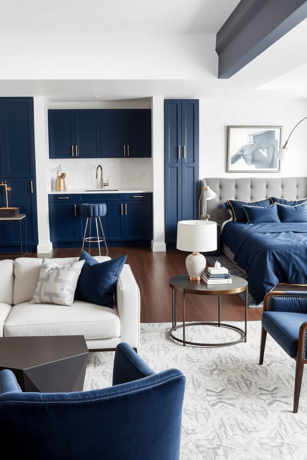 A modern apartment featuring a cohesive color scheme of deep blues and warm grays. The living room showcases a sleek sofa paired with a geometric coffee table and accent chairs that complement the palette. The bedroom includes a king-sized bed with a navy blue duvet and matching throw pillows. A stylish nightstand with a minimalist lamp adds functionality while maintaining the overall aesthetic. The kitchen boasts navy cabinetry with brushed brass hardware and a white marble backsplash. An island with bar stools invites casual dining and socializing in a cohesive design.