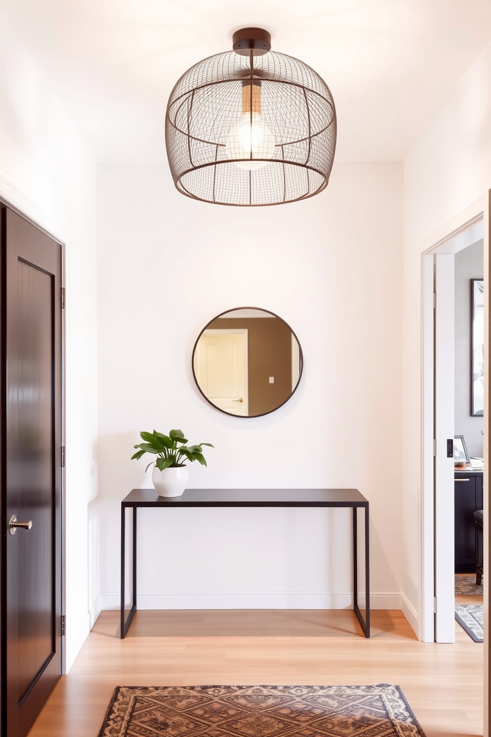 A stylish apartment entryway features a unique light fixture overhead that serves as a focal point. The walls are adorned with a soft neutral paint color, and a sleek console table is positioned against one side. A round mirror hangs above the table, reflecting the light and adding depth to the space. To enhance the entryway, a small potted plant sits on the table, bringing a touch of greenery and warmth.