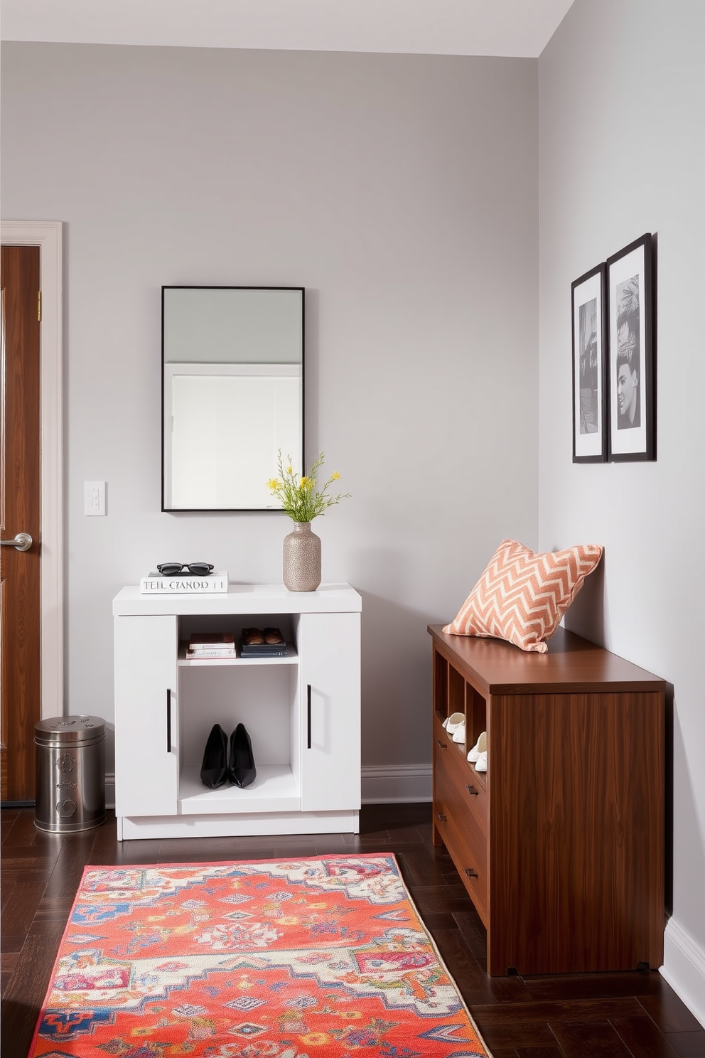 A stylish apartment entryway featuring multifunctional furniture pieces. A sleek console table with built-in storage sits against the wall, paired with a modern mirror above it. To the side, a compact bench offers seating and hidden compartments for shoes. The walls are painted in a soft gray, and a vibrant rug adds a pop of color to the space.