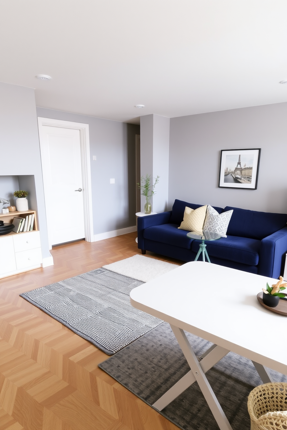 A stylish apartment living room featuring a foldable dining table that seamlessly blends with the decor. The space is designed for flexibility, allowing for easy transitions between dining and relaxation areas. The walls are painted in a soft gray hue, complemented by a plush sofa in a deep navy color. A modern rug anchors the seating area, while decorative pillows add a pop of color and comfort.