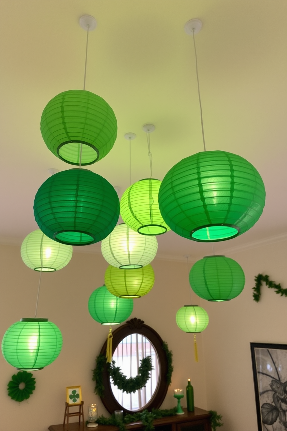 Hanging paper lanterns in various shades of green are suspended from the ceiling, creating a whimsical atmosphere in the apartment. The soft glow of the lanterns casts a warm light, enhancing the festive spirit of St. Patrick's Day decorations throughout the space.