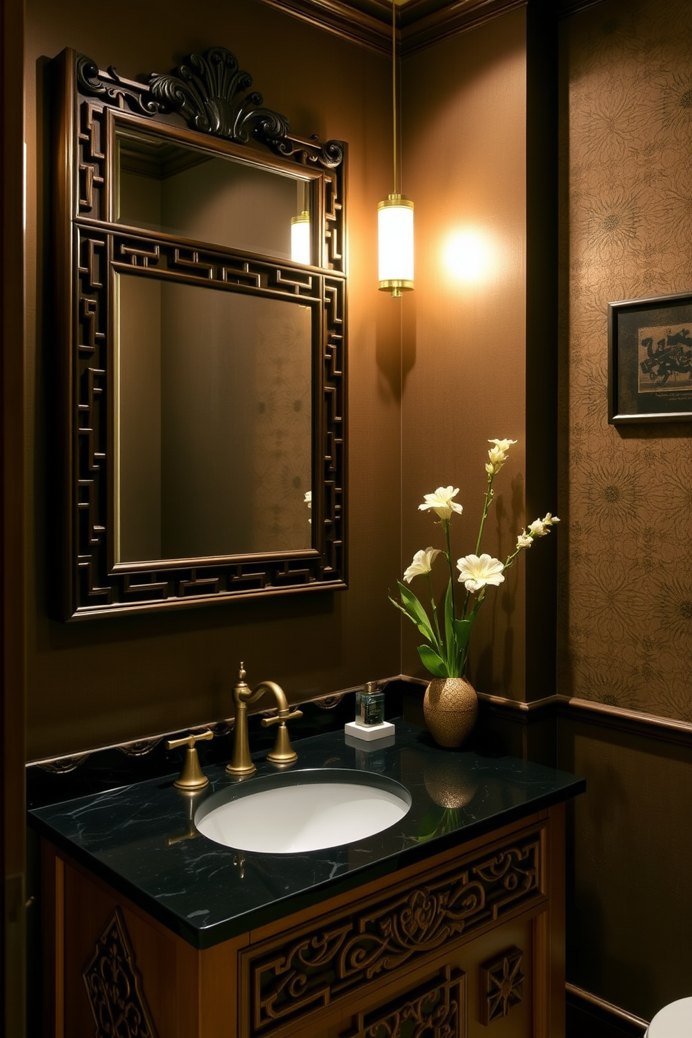 An ornate mirror framed in dark wood hangs prominently on the wall of an Asian-inspired powder room. The space is adorned with rich textures and warm colors, creating a serene and inviting atmosphere. The vanity features a sleek black countertop with intricate carvings, complemented by elegant gold fixtures. Bamboo accents and delicate floral arrangements enhance the tranquil aesthetic, while soft lighting casts a warm glow throughout the room.