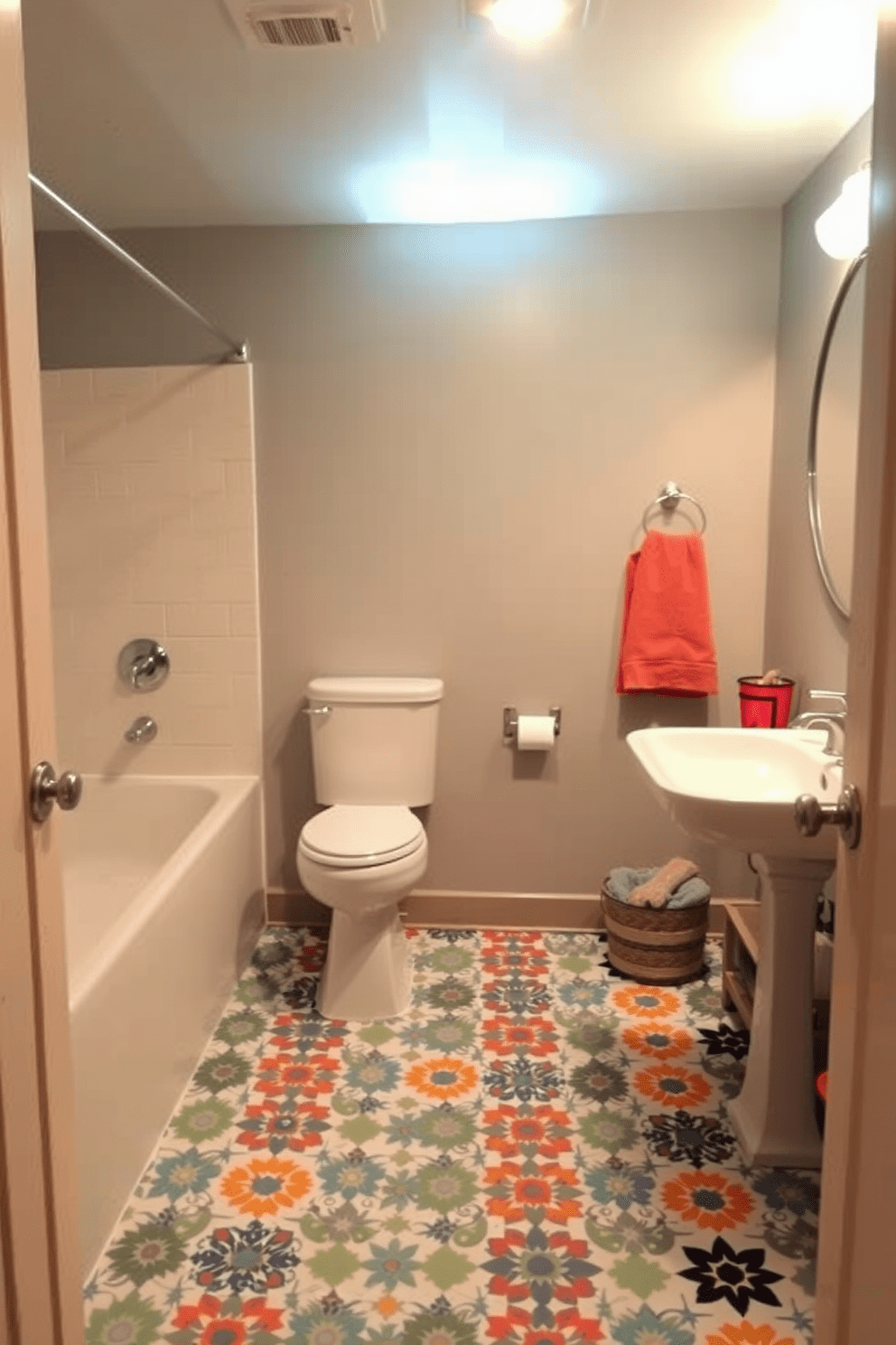 A basement bathroom featuring fun patterned floor tiles that add a playful touch to the space. The walls are painted in a soft gray, complementing the vibrant colors of the tiles while creating a cozy atmosphere.