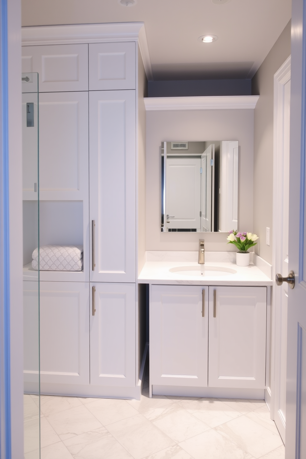 A sleek basement bathroom featuring built-in cabinetry that blends seamlessly with the walls for optimal storage. The cabinetry is finished in a soft white hue, providing a clean and modern aesthetic that enhances the overall space.