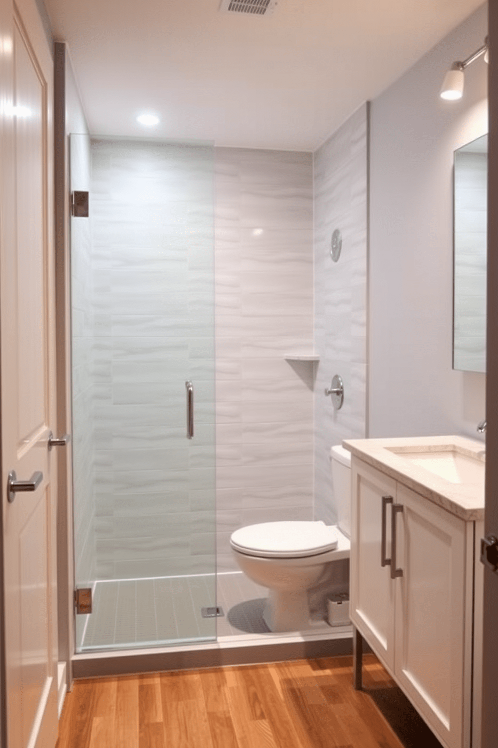 A compact shower with a glass enclosure is the focal point of this basement bathroom design. The walls are adorned with light gray tiles that create a serene atmosphere, while the flooring features durable vinyl planks in a warm wood tone. Next to the shower, a sleek white vanity with a quartz countertop provides ample storage. Soft lighting fixtures are installed above the vanity, illuminating the space and enhancing the modern aesthetic.