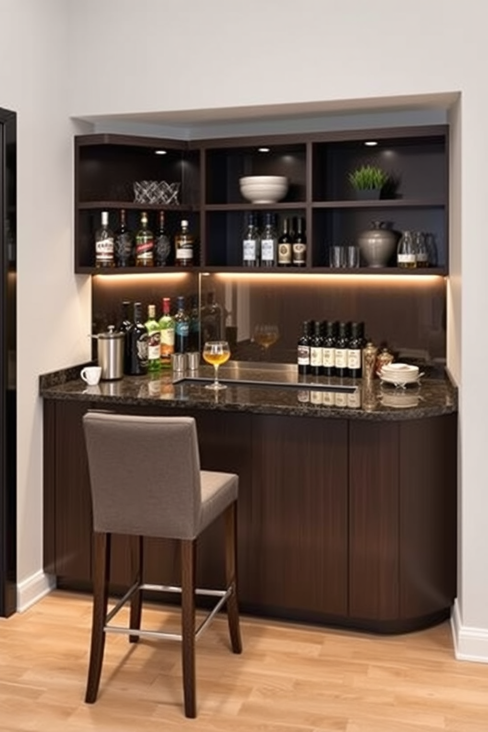 A compact corner bar designed for small spaces features sleek cabinetry in a dark wood finish. The bar top is made of polished granite, providing a stylish surface for mixing drinks and displaying glassware. Above the bar, open shelving showcases an array of spirits and decorative items, while ambient lighting highlights the space. A couple of high-backed stools in a contemporary fabric complete the cozy seating area, making it perfect for entertaining guests.