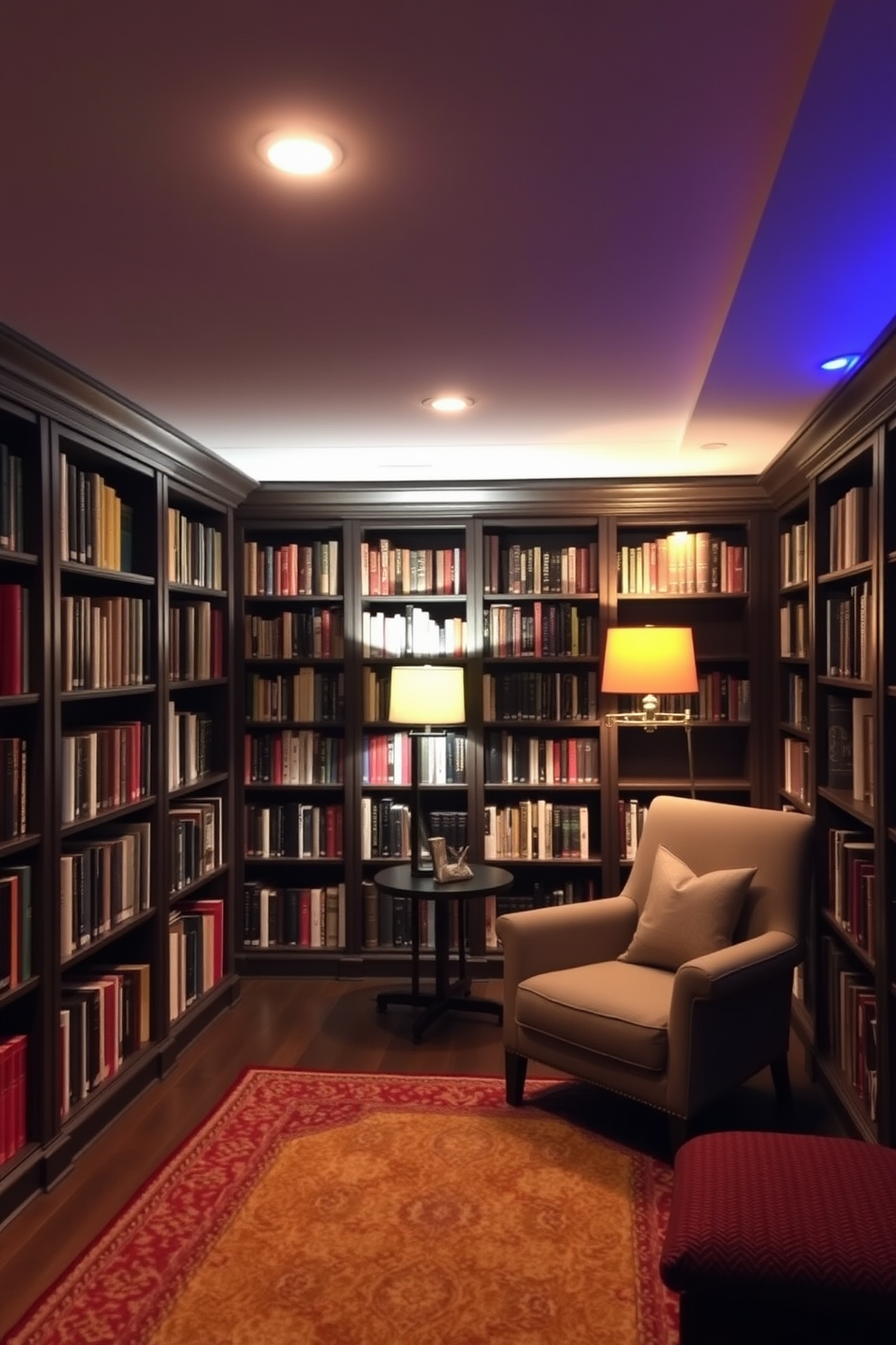 A cozy basement home library with ambient lighting that creates a relaxing atmosphere. The walls are lined with dark wooden bookshelves filled with books, and a plush armchair sits in the corner next to a small side table. Soft, warm lighting fixtures are strategically placed to illuminate the space without being harsh. A large area rug anchors the seating area, and a floor lamp provides additional light for reading.