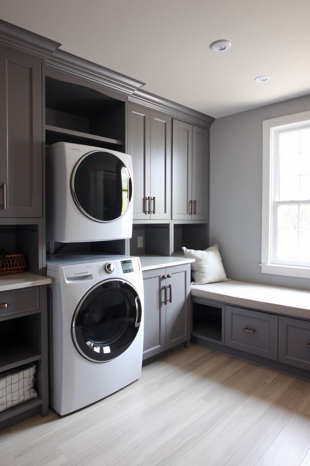 A functional basement laundry room features a spacious layout with ample natural light streaming through a large window. The room includes a sleek washer and dryer set stacked for efficiency, surrounded by custom cabinetry for storage. To one side, a built-in bench provides both seating and storage, adorned with soft cushions for comfort. The walls are painted in a soft gray, and the floor is covered with durable, water-resistant vinyl in a light wood finish.