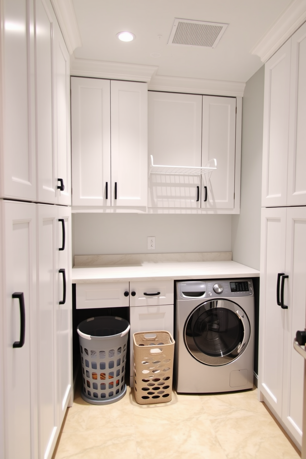 A functional basement laundry room featuring tall cabinets that reach the ceiling for maximum storage. The cabinets are painted in a soft white hue, and the walls are adorned with a light gray color for a clean and bright appearance. In the center, there is a spacious countertop made of quartz, providing ample space for folding laundry. A stylish laundry basket sits next to the countertop, and a wall-mounted drying rack is installed above for added convenience.