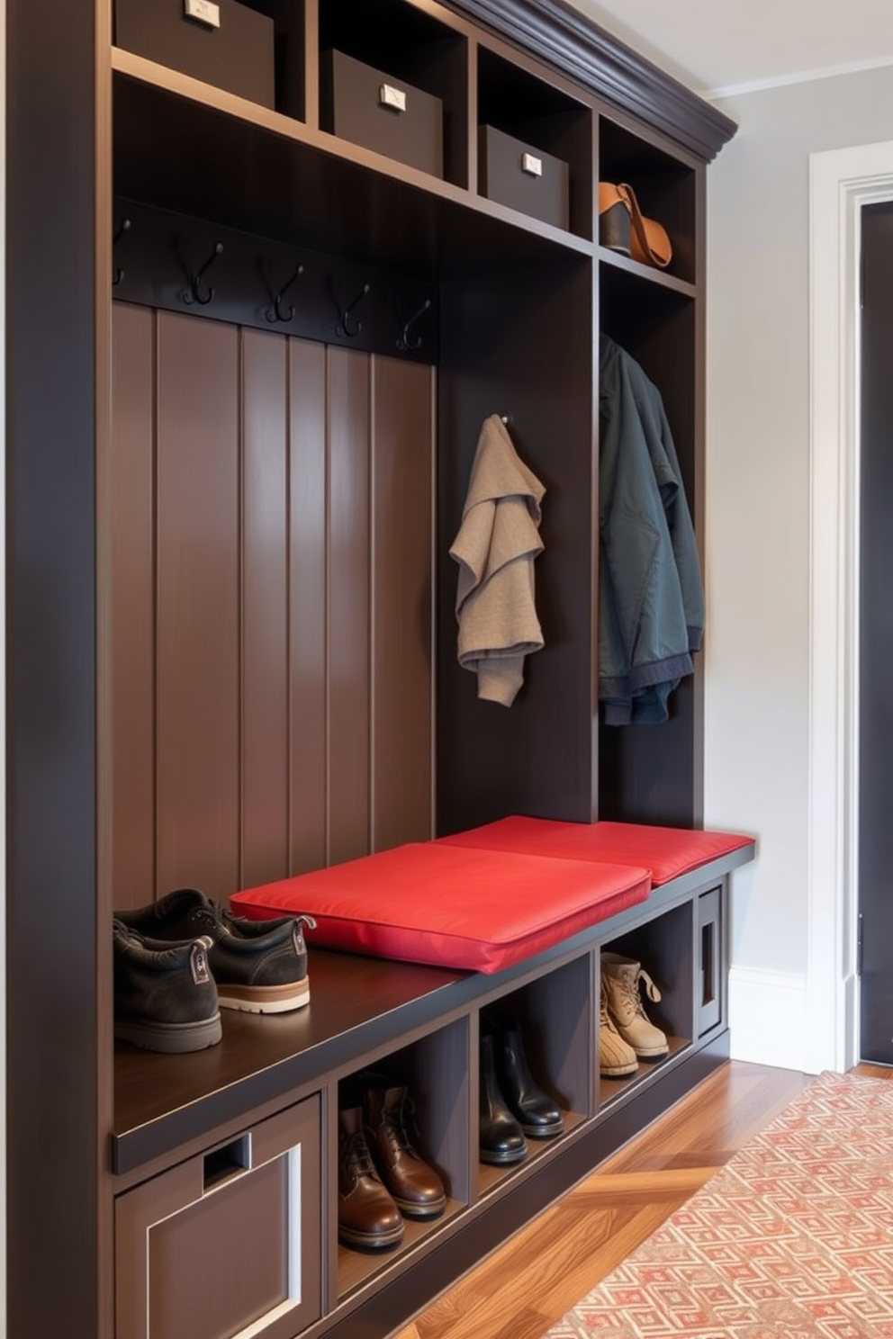 Padded seating is incorporated into the mudroom design to provide both comfort and utility. The seating area features soft cushions in a durable fabric, perfect for putting on or removing shoes. Storage solutions are integrated beneath the padded seating to maximize space and organization. Hooks and shelves are installed nearby for easy access to outerwear and accessories.