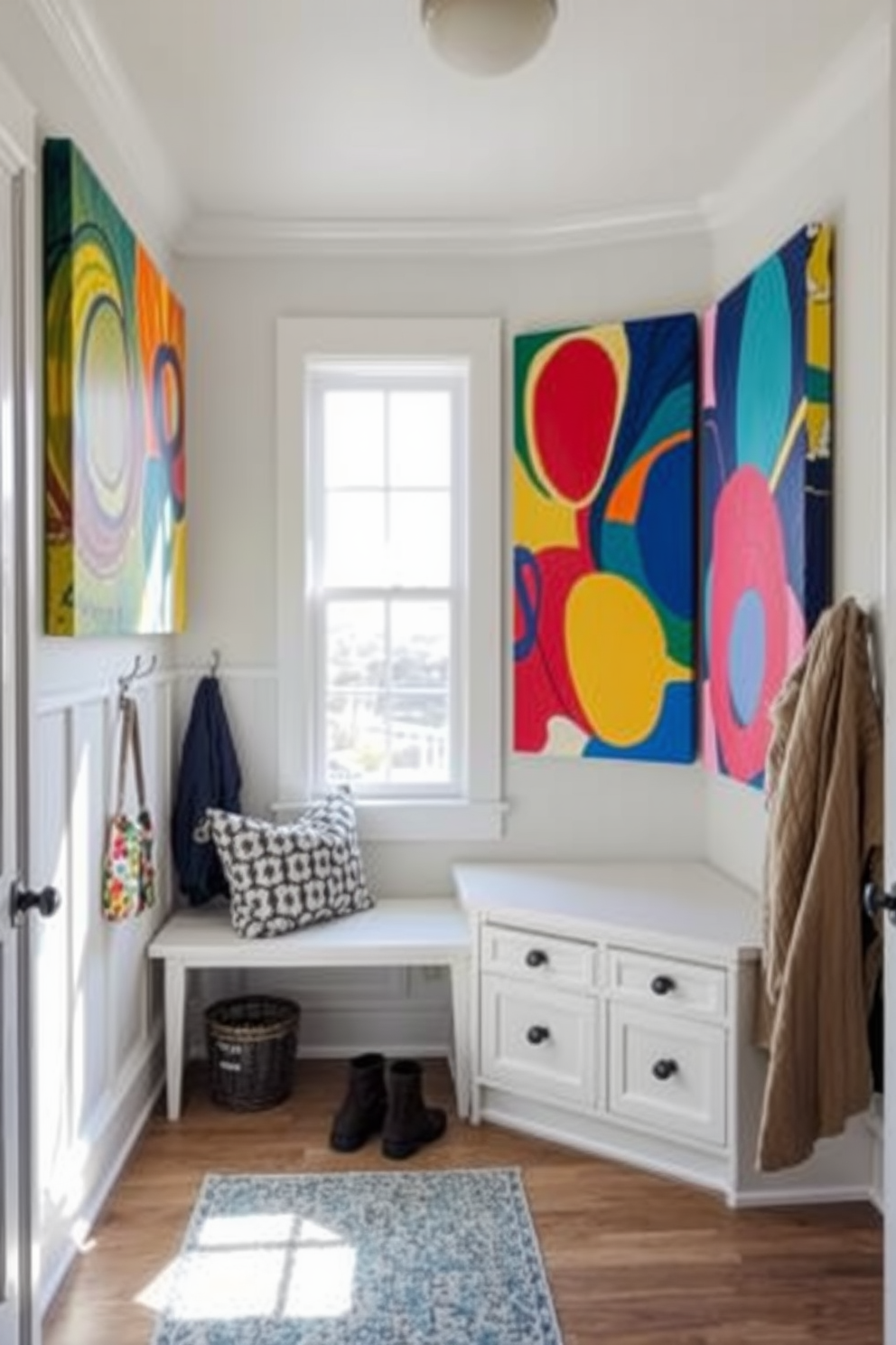 Bright artwork to liven up the space. The walls are adorned with large, colorful canvases that feature abstract designs and vibrant hues. The mudroom features a functional layout with built-in storage benches and hooks for coats. Natural light floods the area through a large window, highlighting the cheerful decor and inviting atmosphere.