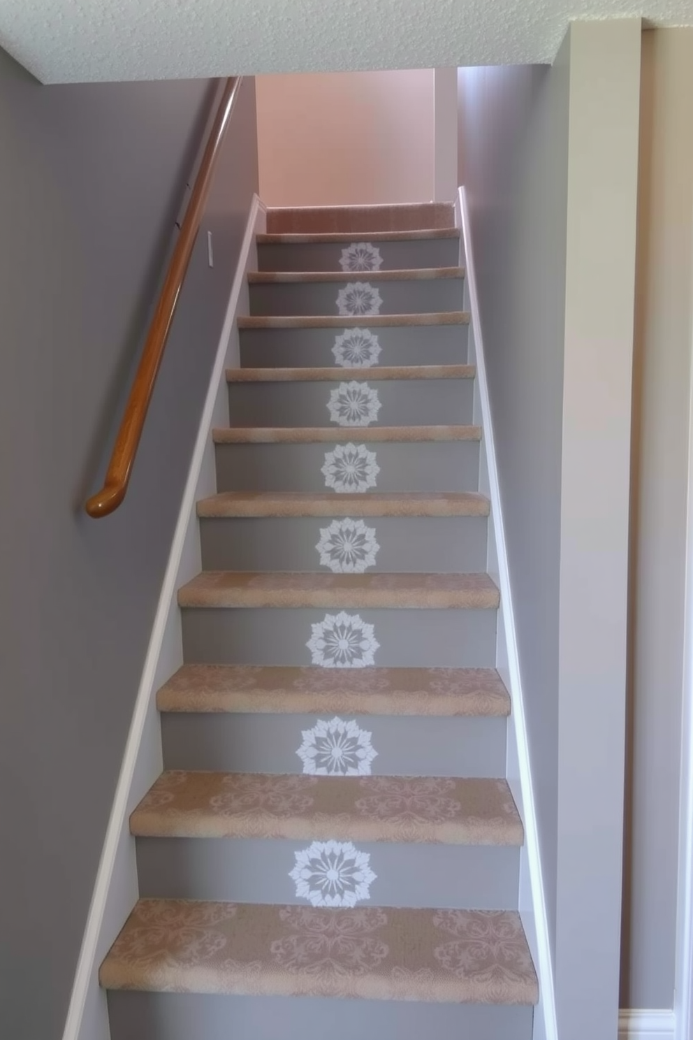 A basement staircase features stenciled designs on the risers that add a unique artistic touch. The surrounding walls are painted in a soft gray, creating a modern and inviting atmosphere.