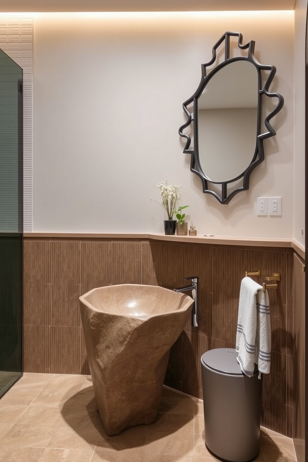 A stylish basement washroom featuring unique sink designs that add character. The focal point is a sculptural freestanding sink made of natural stone, complemented by sleek brass fixtures. The walls are adorned with textured tiles in earthy tones, creating a warm and inviting atmosphere. A large mirror with an artistic frame reflects the unique sink, enhancing the overall aesthetic of the space.