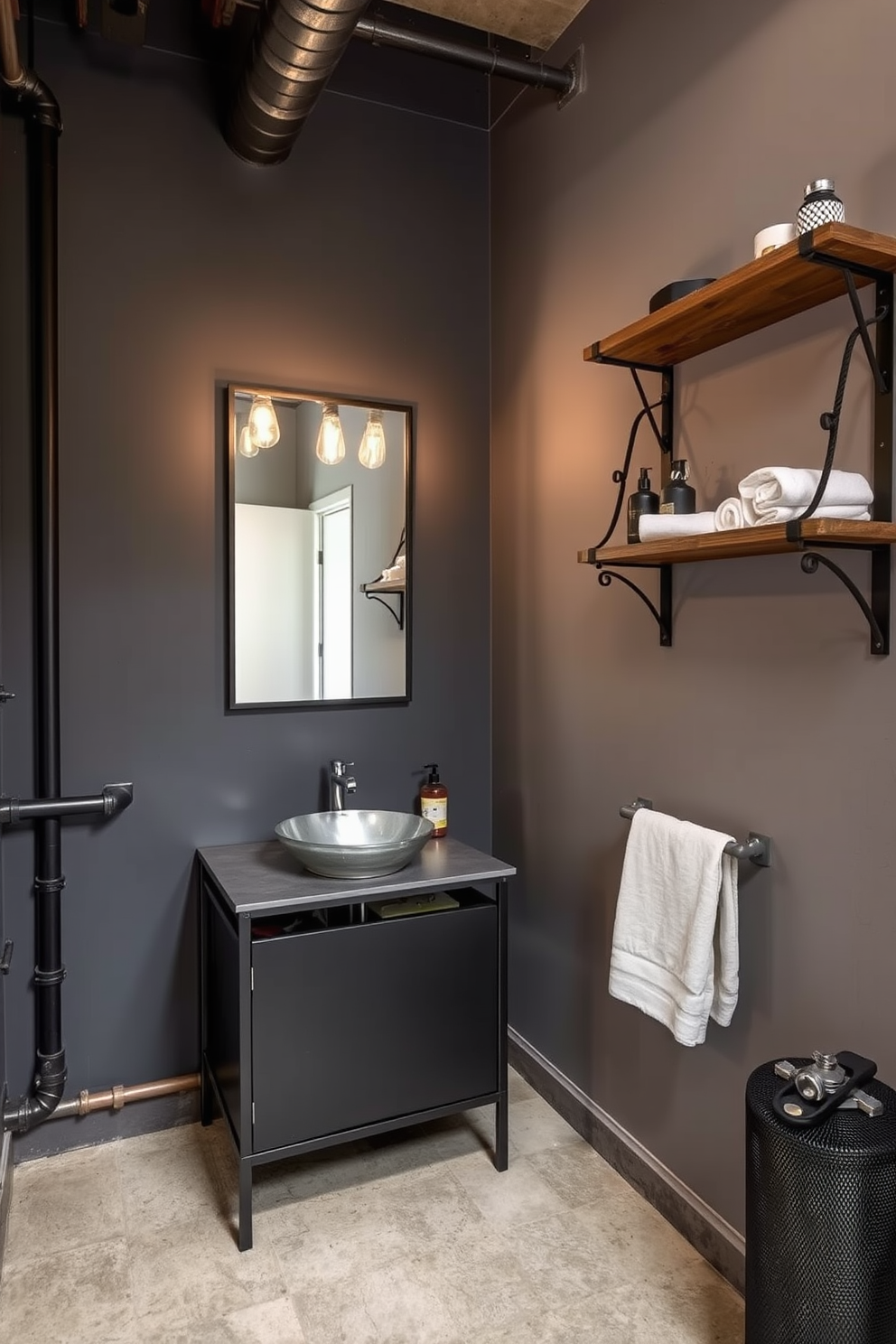 An industrial style basement washroom features exposed pipes and a concrete floor that adds an edgy touch. The walls are painted in a dark gray tone, and there is a sleek metal vanity with a vessel sink that complements the overall aesthetic. A large mirror with a black metal frame hangs above the vanity, reflecting the warm light from vintage-style Edison bulbs. To enhance the industrial feel, a wooden shelf with metal brackets is mounted on the wall, showcasing neatly rolled towels and unique decor items.