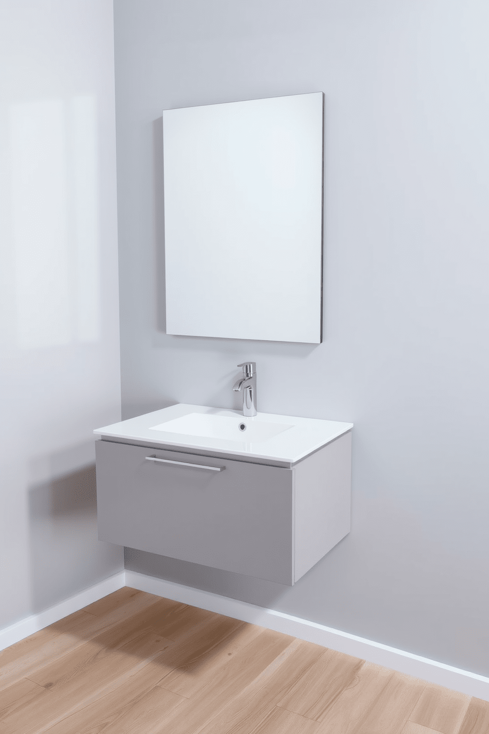 A sleek floating vanity is mounted against a soft gray wall, creating a modern aesthetic. The vanity features a white quartz countertop with an undermount sink, complemented by minimalist chrome fixtures. Above the vanity, a large frameless mirror reflects natural light, enhancing the spacious feel of the room. The floor is adorned with light wood planks, adding warmth to the contemporary design.