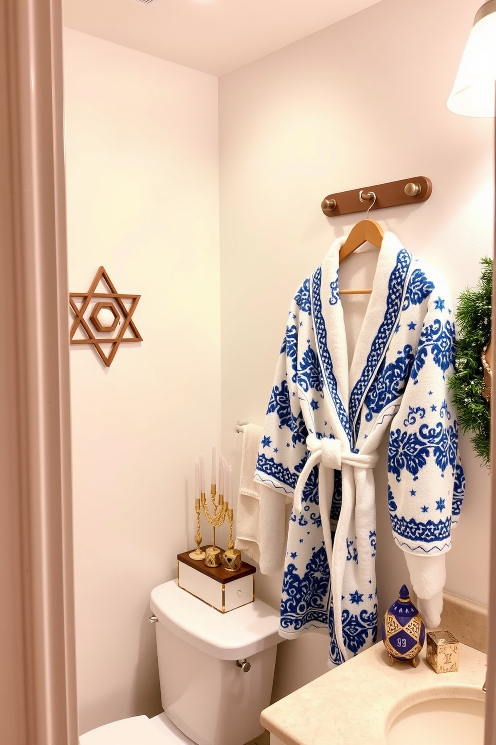 A cozy bathroom adorned for Hanukkah. A plush bathrobe with blue and white patterns hangs on a wooden rack, complemented by festive decorations like menorahs and dreidels on the countertop. The walls are painted in a soft white, creating a bright and inviting atmosphere. Warm lighting illuminates the space, enhancing the holiday spirit with touches of gold and silver accents throughout.