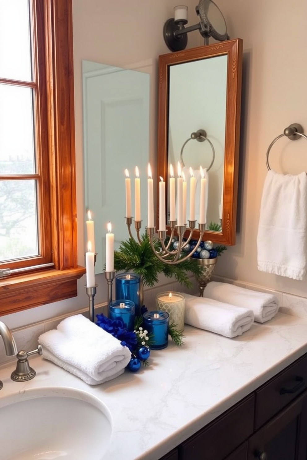 A cozy bathroom adorned for Hanukkah. The space features a wooden vanity with a marble countertop, where holiday scented candles are artfully arranged to create a warm ambiance. Decorative elements in shades of blue and silver enhance the festive atmosphere. A menorah sits on the windowsill, surrounded by fresh greenery and soft white towels.