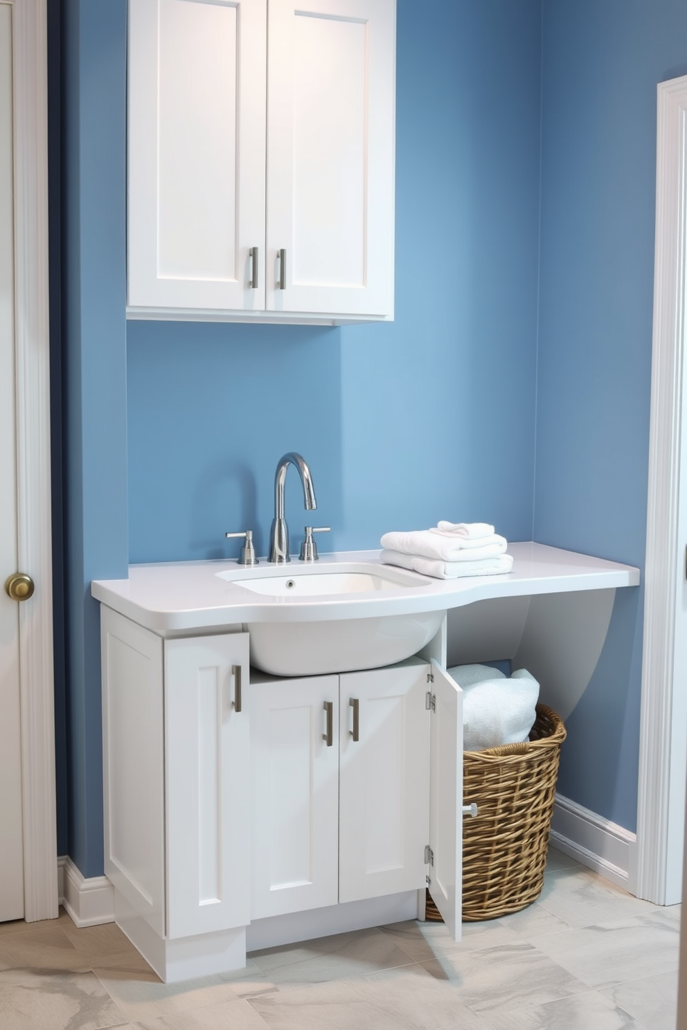 A stylish corner sink designed for laundry functionality features a sleek, modern faucet and a spacious countertop for folding clothes. The walls are painted in a soft blue tone, complemented by white cabinetry that provides ample storage for laundry essentials. The floor is adorned with durable, water-resistant tiles in a light gray hue, creating a clean and functional space. A decorative basket sits beside the sink, filled with neatly folded towels, adding a touch of warmth to the practical design.