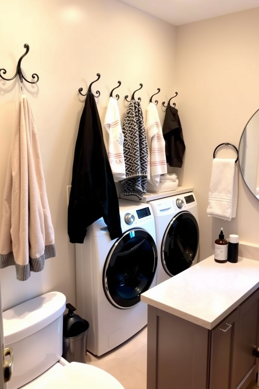 A stylish laundry room that also serves as a bathroom. The design features decorative hooks for towels and clothes on the wall, adding both functionality and charm. The space includes a sleek washer and dryer tucked into cabinetry with a countertop for folding clothes. Soft lighting illuminates the area, creating a warm and inviting atmosphere.