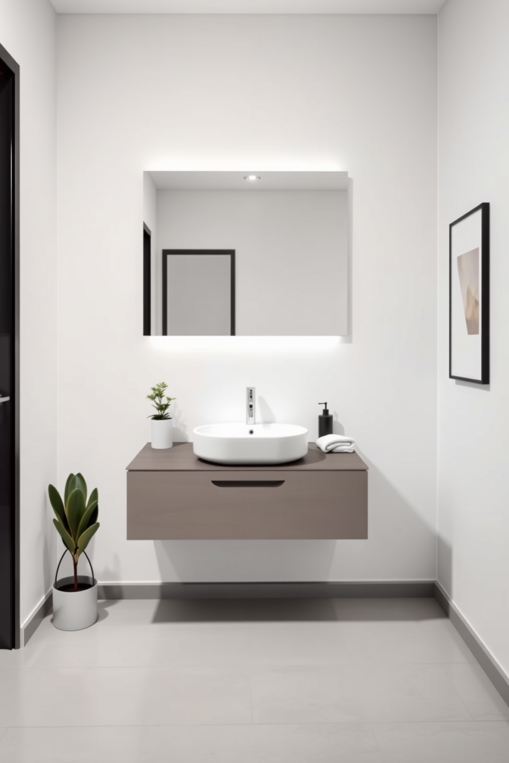 Sleek minimalism defines the bathroom powder room with a clean white wall backdrop and a floating vanity featuring a single basin sink. The space is accented by a large frameless mirror and a subtle pendant light that adds a touch of elegance. The floor is adorned with light gray tiles that create a seamless look, while a small potted plant adds a hint of greenery. Simple accessories, such as a sleek soap dispenser and a neatly folded towel, enhance the uncluttered aesthetic.