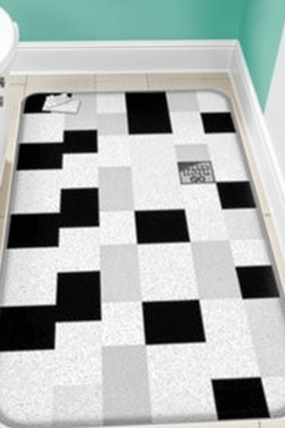 A classic checkerboard bathroom rug design features alternating black and white squares that evoke a sense of retro charm. This timeless pattern adds a playful yet elegant touch to any bathroom decor. The rug is made from soft, durable materials that provide comfort underfoot while enhancing the overall aesthetic. It can be paired with vintage-inspired fixtures and accessories to create a cohesive look.