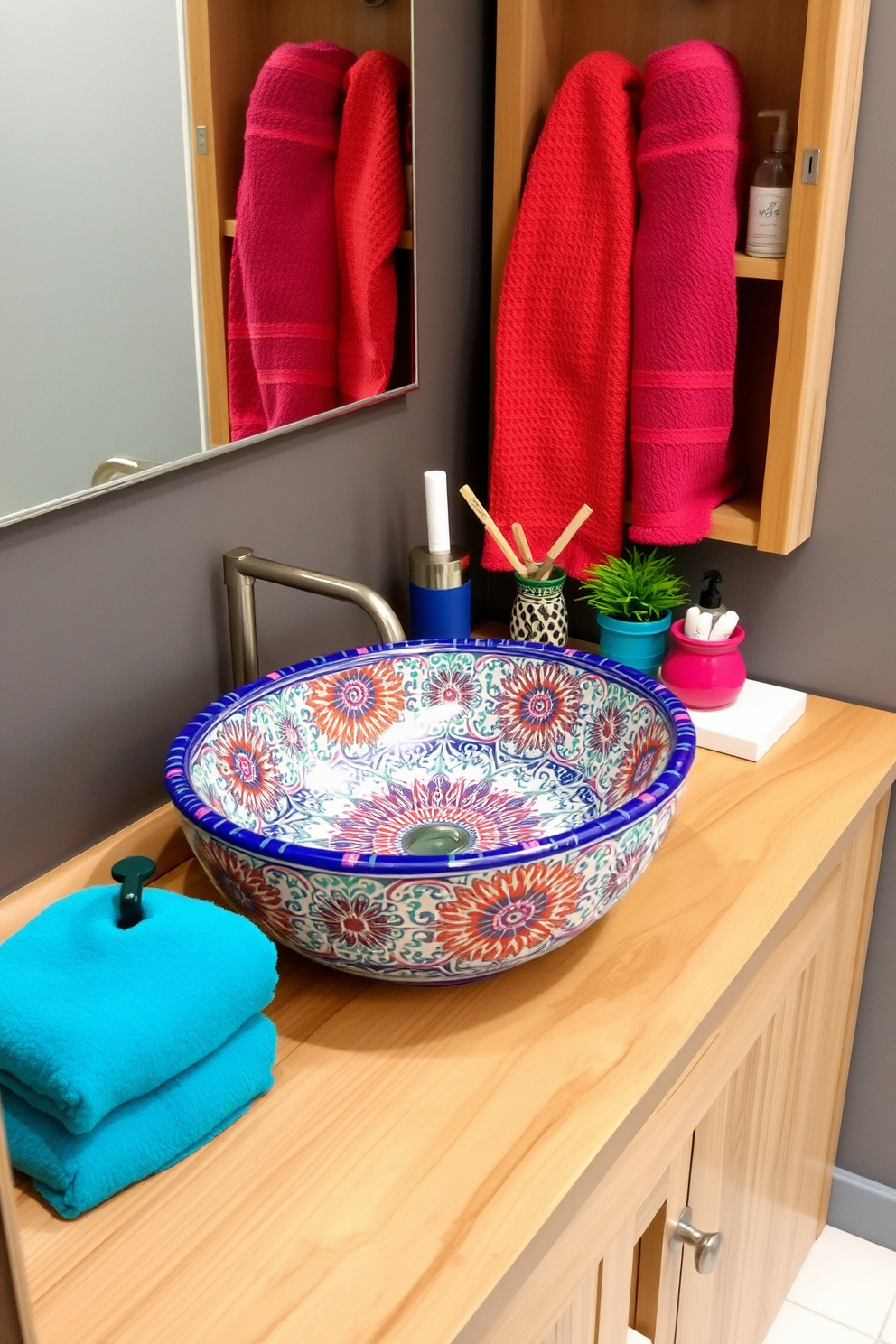 A colorful ceramic sink serves as the focal point of the bathroom, showcasing intricate patterns that add a touch of artistic flair. Surrounding the sink, the countertop features natural wood accents and a selection of vibrant accessories that complement the sink's design.