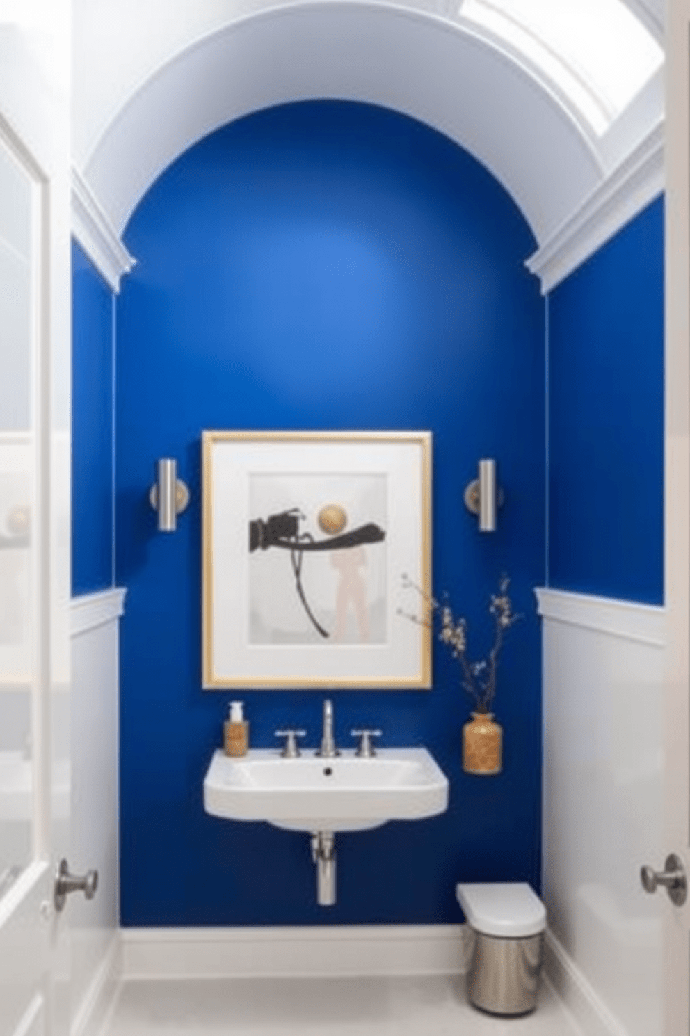 An accent wall painted in a bold deep blue creates a striking focal point in the bathroom. The surrounding walls are finished in a soft white, enhancing the vibrancy of the accent while maintaining a clean and airy feel. The bold color is complemented by sleek modern fixtures and minimalist decor. A large framed artwork hangs on the accent wall, adding personality and style to the overall design.