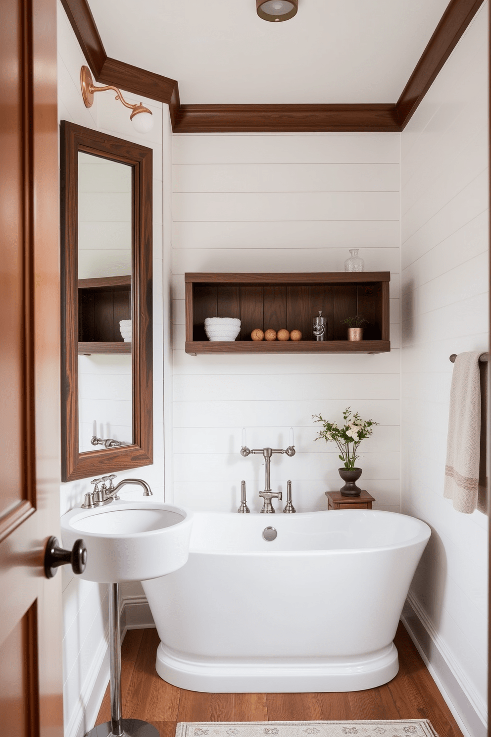 Classic shiplap lines the walls of the bathroom, creating a warm and inviting atmosphere. The soft white finish of the shiplap contrasts beautifully with the dark wood accents found in the mirror frame and shelving. A freestanding soaking tub is positioned against the shiplap wall, offering a serene focal point. The space is adorned with vintage-inspired fixtures in brushed nickel, enhancing the rustic charm of the design.