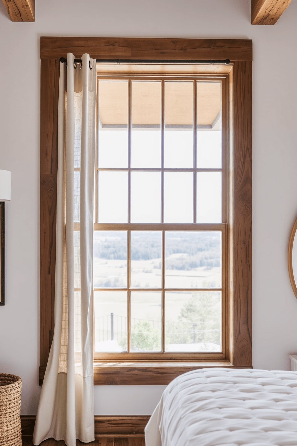 Custom wood frames for rustic charm. The window features a large wooden frame with a distressed finish, complemented by soft linen curtains that gently filter the light. The view outside showcases a serene landscape, enhancing the cozy atmosphere of the room. Natural wood accents throughout the space create a harmonious connection with the outdoors.