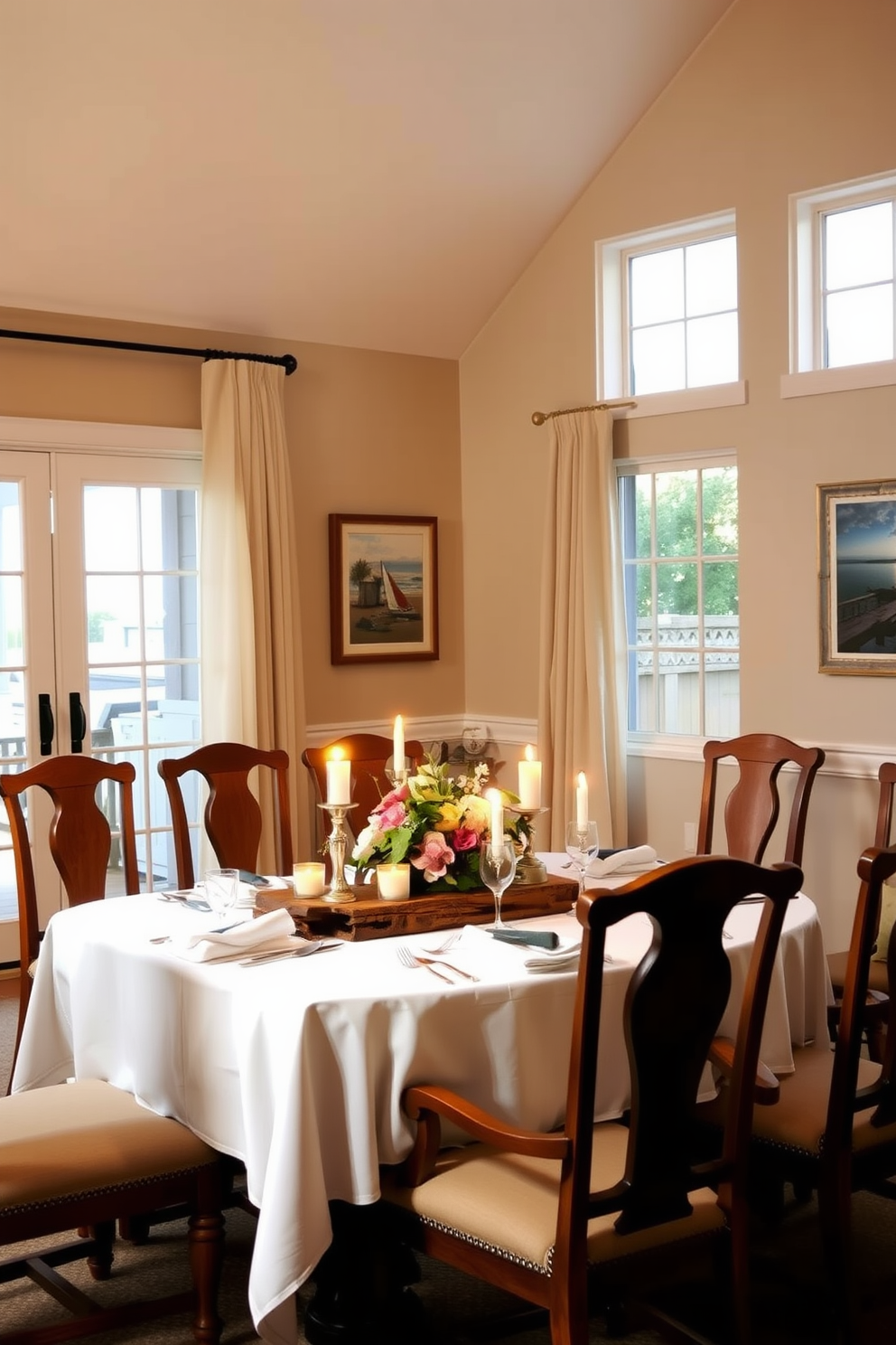 A warm and inviting dining room illuminated by soft candlelight. The table is elegantly set with white linens and rustic wooden accents, surrounded by comfortable upholstered chairs. The walls are painted in a soft beige, creating a serene backdrop. Large windows allow natural light to filter in, complemented by sheer curtains that flutter gently in the breeze. A centerpiece of fresh flowers and flickering candles adds a touch of romance. The room is adorned with artwork that reflects coastal themes, enhancing the beachy vibe.