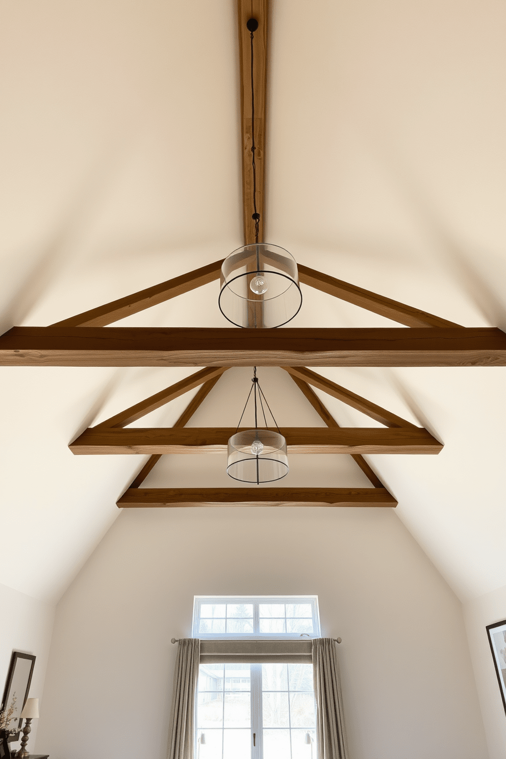 A vaulted ceiling creates an airy and spacious atmosphere in the bedroom. The design features exposed wooden beams that add warmth and character to the room. Soft, neutral colors on the walls enhance the feeling of openness while complementing the natural light that floods in. Elegant pendant lights hang from the apex of the ceiling, providing both style and illumination.