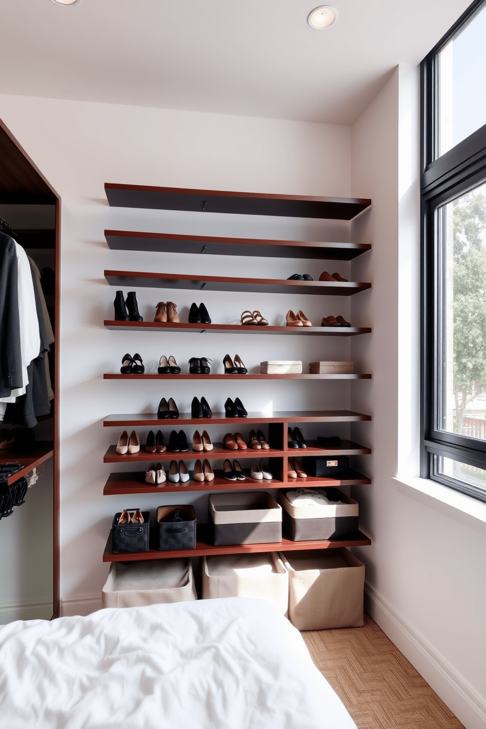 Floating shelves are elegantly arranged in a modern bedroom closet, showcasing a curated collection of shoes and accessories. The shelves are made of sleek, dark wood, contrasting beautifully with the light-colored walls and adding a touch of sophistication to the space. The closet features a minimalist design with ample natural light streaming through a large window. Soft, neutral tones create a calming atmosphere, while stylish storage bins maintain organization and enhance the overall aesthetic.