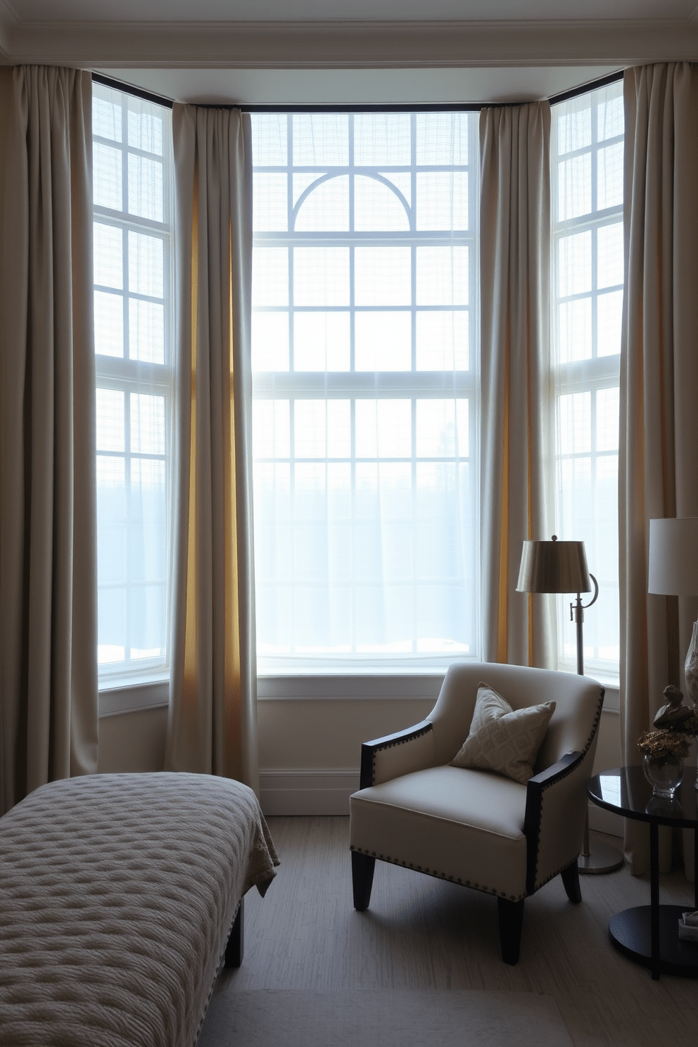 A serene bedroom featuring panel curtains that elegantly frame the large windows. The curtains are made of a soft, light-filtering fabric in a neutral tone, allowing natural light to softly illuminate the room. The bed is dressed in luxurious linens, complemented by decorative pillows that add a pop of color. A cozy reading nook is nearby, with a stylish armchair and a small side table adorned with a decorative lamp.