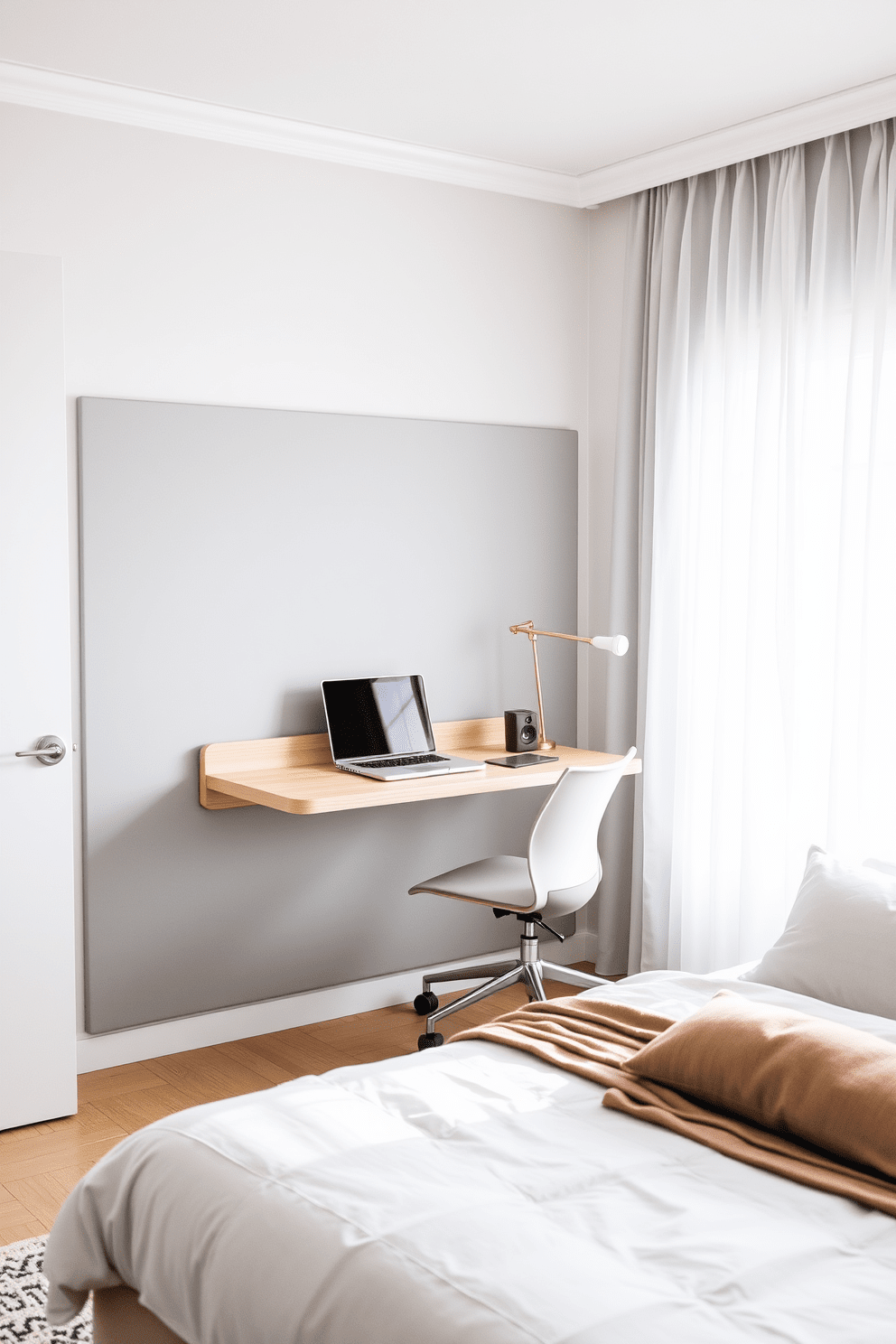 A serene bedroom setting featuring a wall-mounted desk that maximizes space and efficiency. The desk is made of light wood and is complemented by a comfortable, ergonomic chair, creating a perfect workspace. The bed is positioned against a soft gray accent wall, adorned with plush pillows and a cozy throw blanket. Natural light filters through sheer curtains, illuminating the room and enhancing the calming atmosphere.