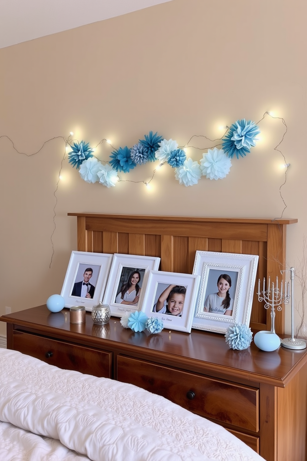 A cozy bedroom setting adorned with personalized Hanukkah photo frames. The frames are displayed on a wooden dresser, surrounded by soft blue and silver decorations that evoke the spirit of the holiday. The walls are painted in a warm neutral tone, creating a serene backdrop for the festive decor. Twinkling fairy lights drape across the headboard, enhancing the inviting atmosphere of the room.