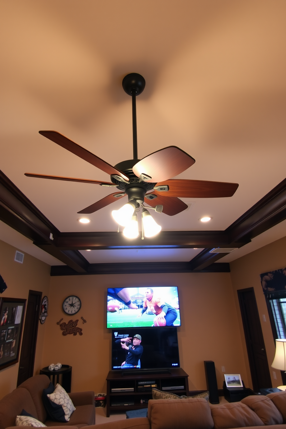 A unique ceiling fan with an artistic design hangs from the ceiling, featuring wooden blades and an intricate metal frame. The fan complements the warm color palette of the room, enhancing the cozy atmosphere. The bedroom man cave is designed with plush seating, a large flat-screen TV, and ambient lighting for a relaxed vibe. Dark wood accents and sports memorabilia create a personalized touch, making it the perfect retreat for relaxation and entertainment.