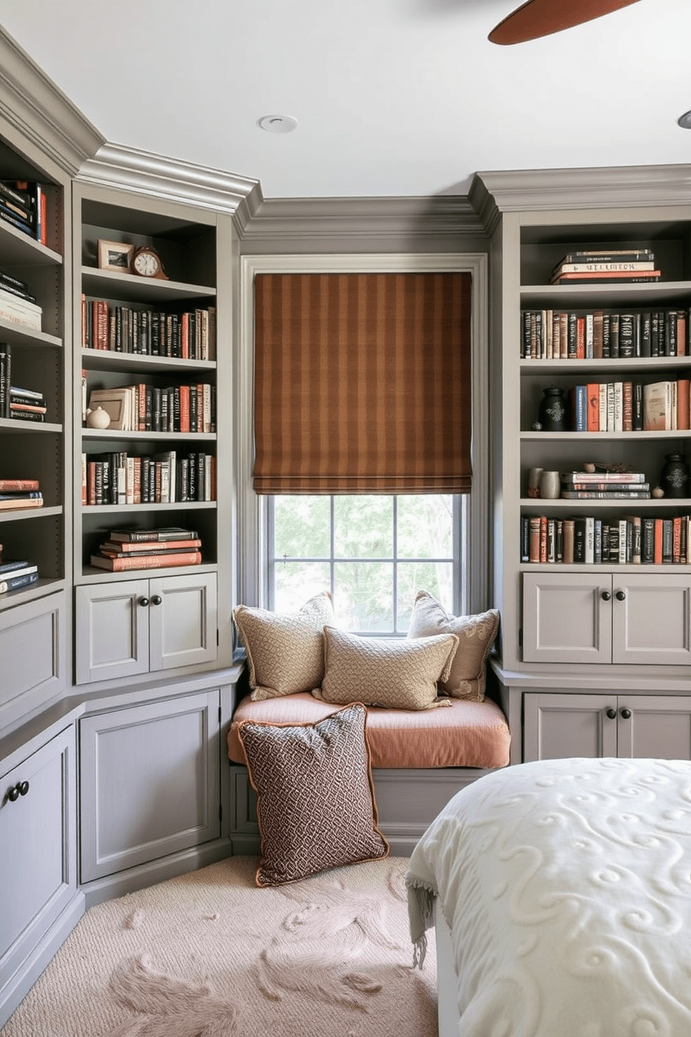 A cozy bedroom reading nook features built-in bookshelves that stretch from floor to ceiling, filled with an array of books and decorative items. Soft cushions in various textures and colors are arranged on a plush window seat, inviting relaxation and comfort.