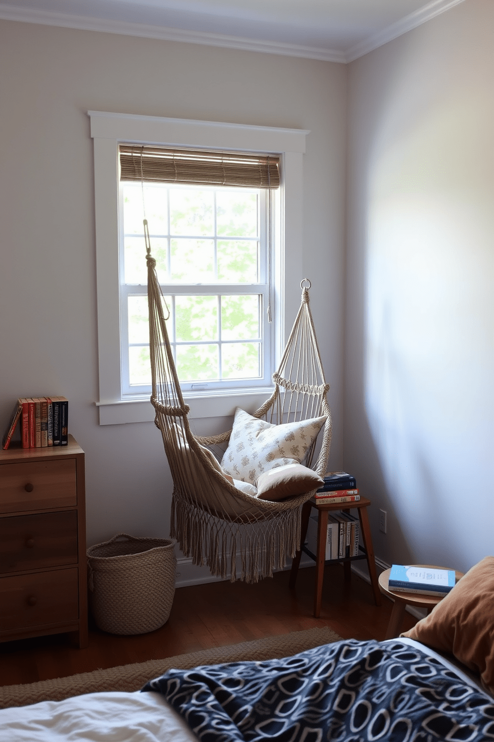 A cozy bedroom reading nook featuring a hammock chair suspended in a corner. Soft natural light filters through a nearby window, illuminating a collection of books on a small wooden side table.