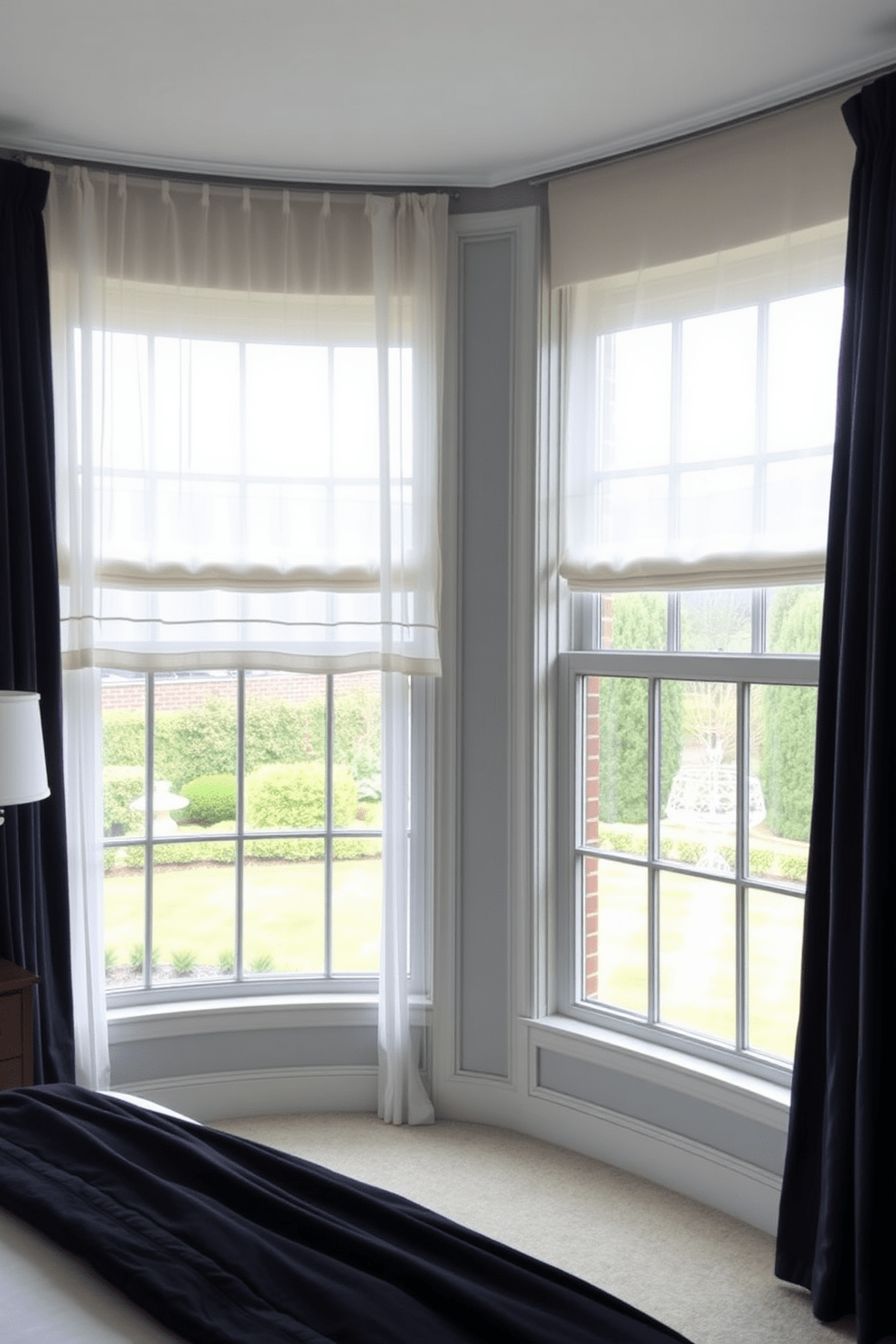 Layered window treatments create a sense of depth and elegance in a bedroom. Sheer curtains in a soft white hue are paired with rich, textured drapes in a deep navy, framing a large window that overlooks a serene garden.