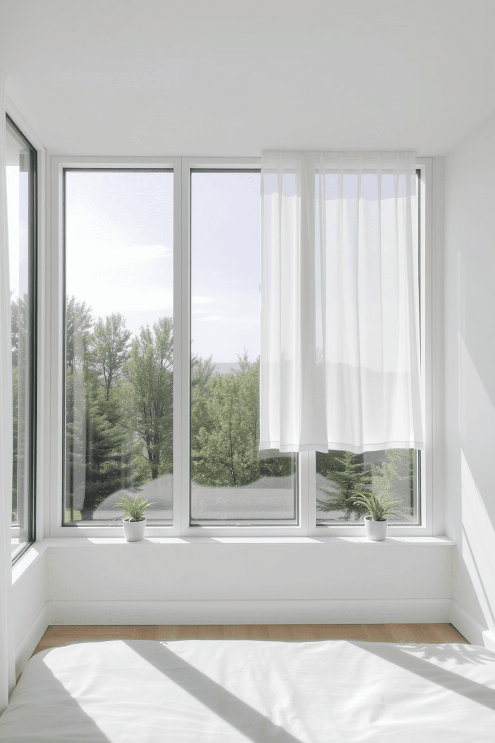 A minimalist bedroom window design features large floor-to-ceiling windows that allow plenty of natural light to flood the space. The window frames are sleek and unobtrusive, painted in a soft white to blend seamlessly with the walls. Sheer white curtains gently drape from the top of the windows, adding a touch of softness without obstructing the view. The window sills are adorned with small potted plants, bringing a hint of greenery into the serene environment.