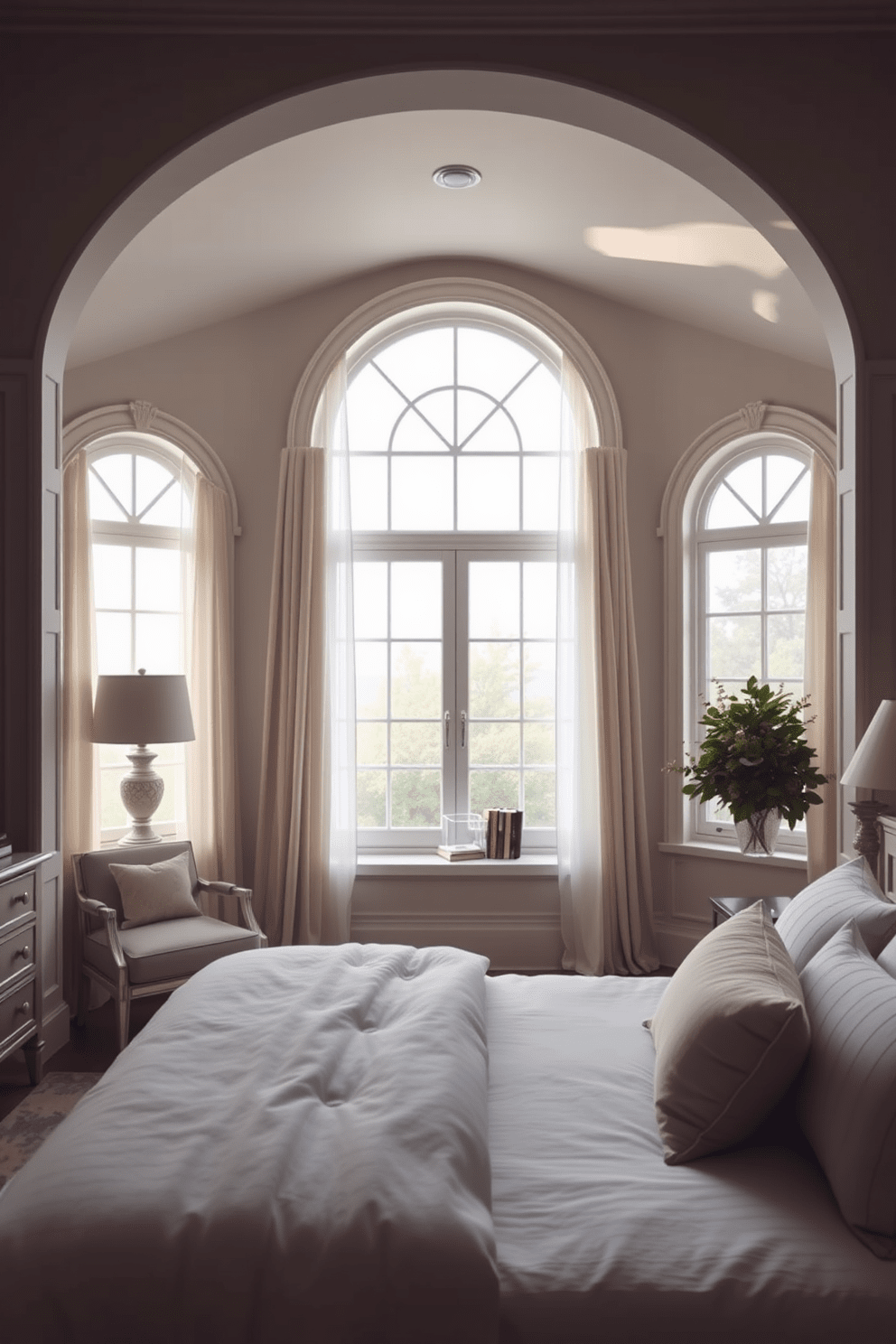 A serene bedroom featuring arched windows that create a stunning focal point. The soft natural light filters through sheer curtains, illuminating the elegant furnishings and calming color palette. The windows are framed with decorative molding that adds architectural interest. Plush bedding and a cozy reading nook complete the inviting atmosphere of the space.