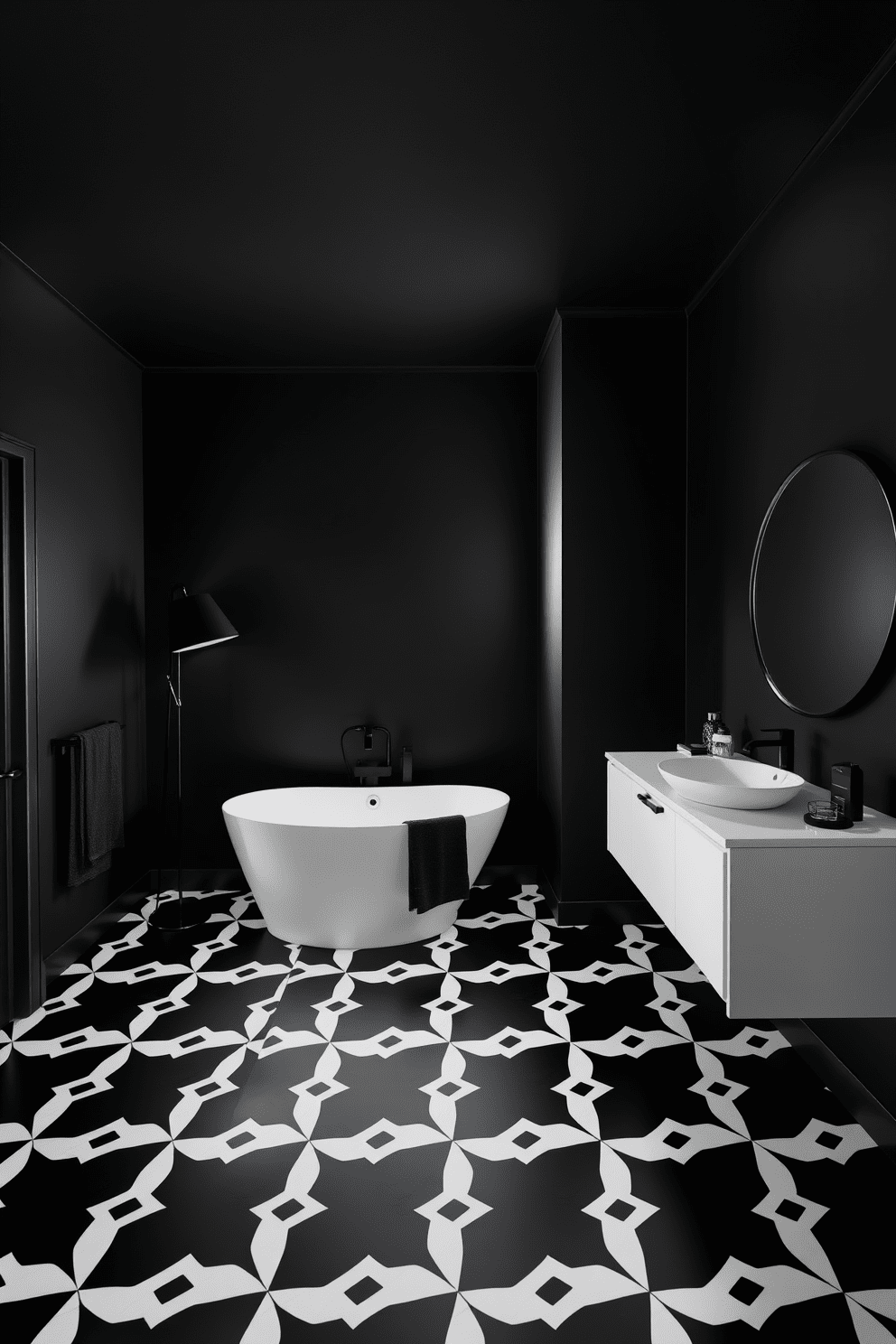 A striking black bathroom featuring black and white geometric floor tiles that create a bold visual contrast. The walls are painted in a deep matte black, enhancing the sleek and modern aesthetic of the space. A freestanding white bathtub sits elegantly in the center, complemented by a minimalist black floor lamp nearby. Stylish black fixtures and accessories add to the contemporary feel, while a large round mirror reflects the unique tile pattern.