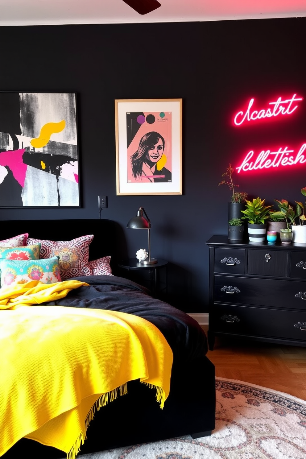 An eclectic black bedroom setting featuring a bold black accent wall adorned with an oversized piece of abstract art. The room is complemented by vibrant accents such as a bright yellow throw blanket draped over a plush black velvet bed and colorful pillows scattered across the bed. A stylish black dresser with unique hardware stands against the wall, topped with an arrangement of potted plants in various sizes. The floor is covered with a soft, patterned area rug that adds warmth and texture, while a striking neon sign illuminates the space with a playful glow.