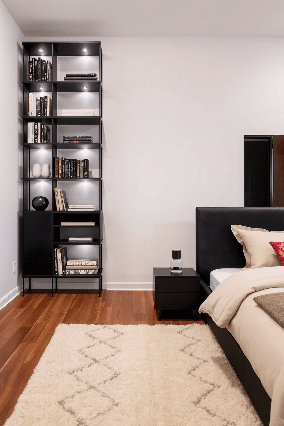 A modern black shelving unit lines the wall, showcasing a curated selection of books and decorative items. The unit is complemented by subtle lighting that highlights the textures and colors of the displayed pieces. The bedroom features a sleek black bed frame with plush bedding in contrasting light tones. Accent pillows add a pop of color, while a cozy area rug anchors the space, creating an inviting atmosphere.