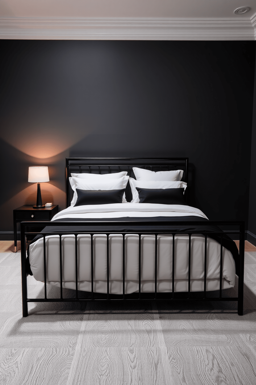 A sleek black metal bed frame sits at the center of the room, exuding modern elegance. The bed is adorned with crisp white linens and plush black pillows, creating a striking contrast. The walls are painted in a deep charcoal gray, enhancing the room's sophisticated ambiance. A minimalist bedside table in black wood complements the bed frame, topped with a stylish lamp that casts a warm glow.