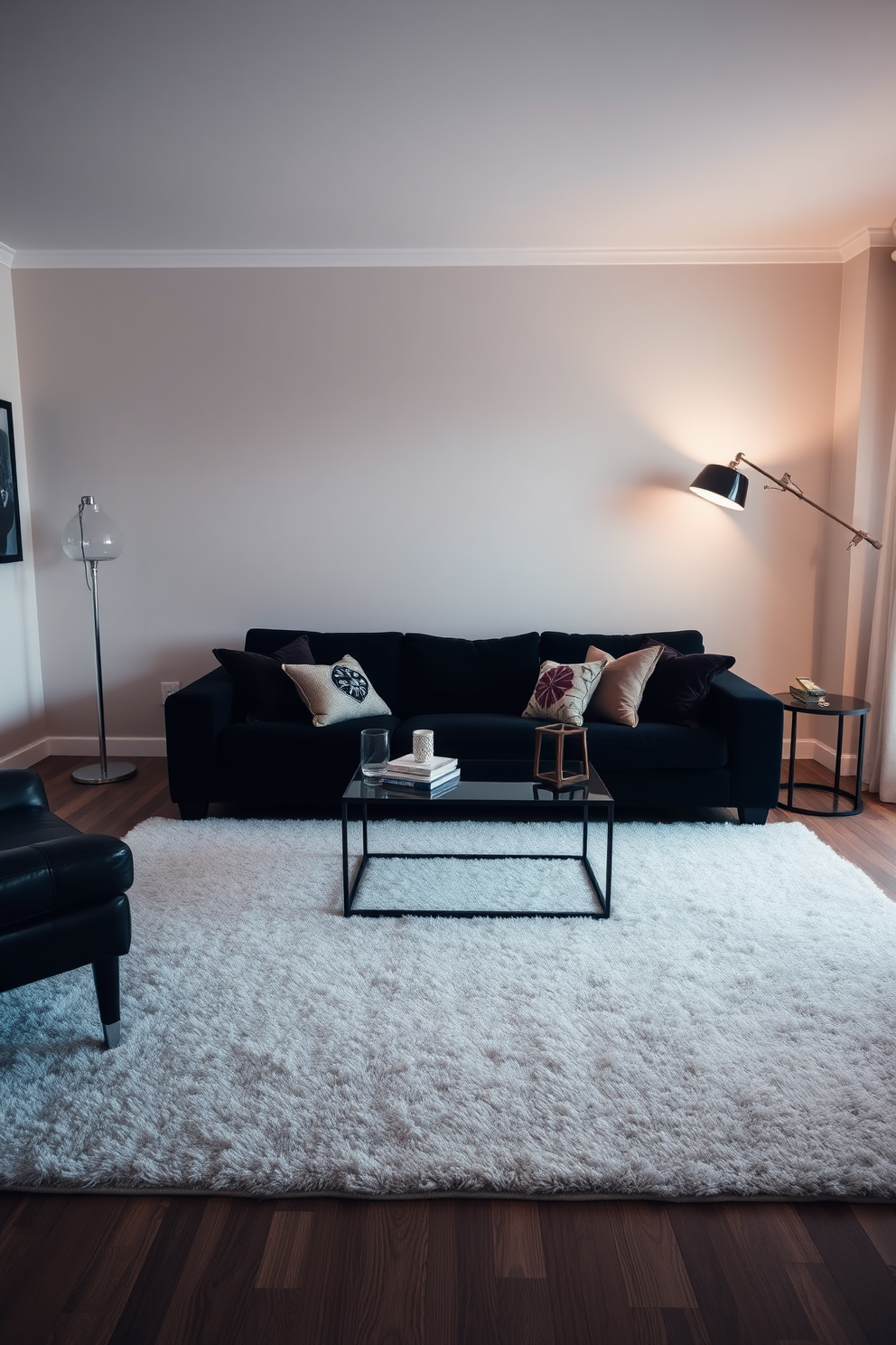 A stylish living room featuring a black couch as the centerpiece. The space is defined by a large area rug that delineates the seating area, enhancing the cozy atmosphere. Soft lighting from elegant floor lamps creates a warm ambiance. Decorative throw pillows in contrasting colors add visual interest to the black couch.